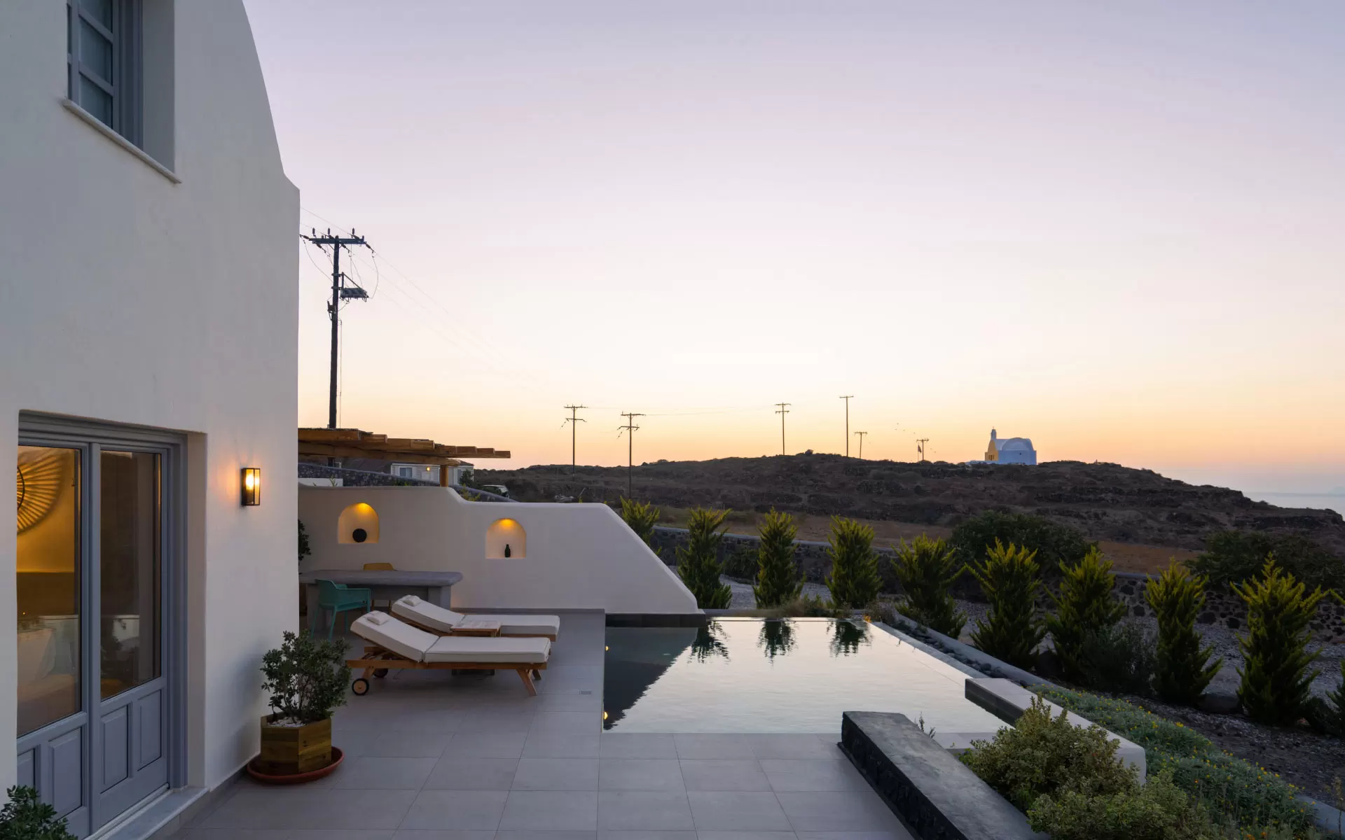 Private heated pool at sunset, Phaos Saint John Villas