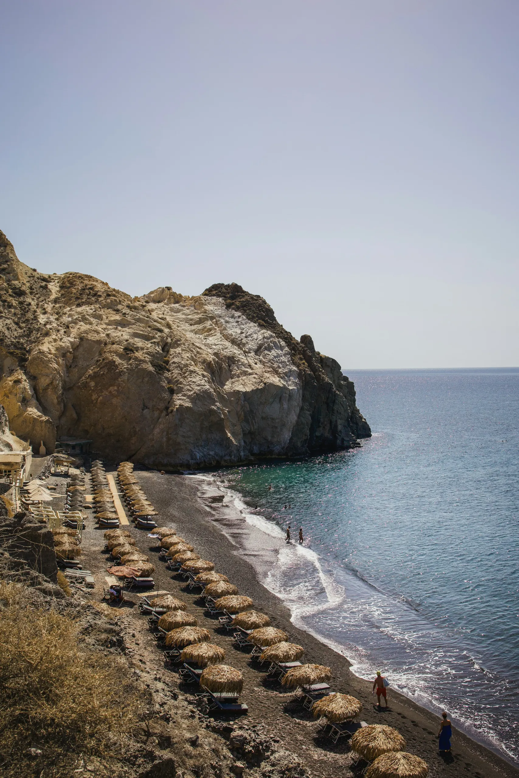Quiet beach beneath a rocky headland