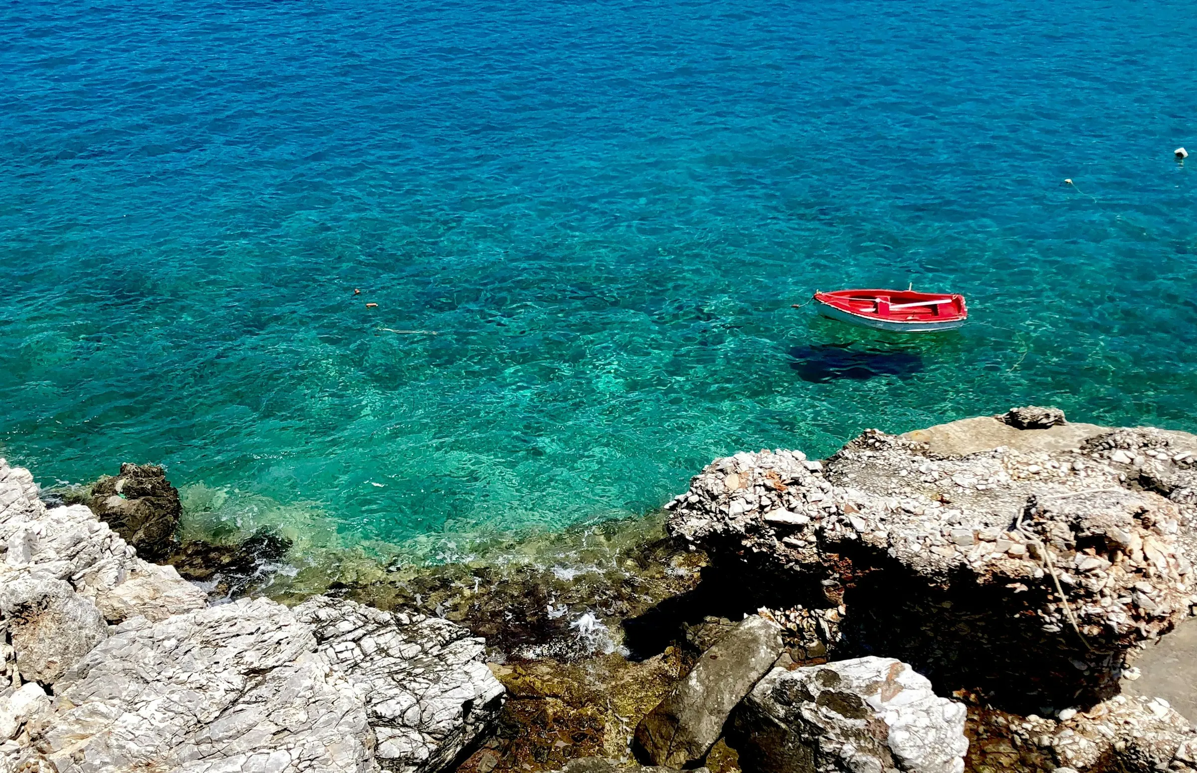 Red boat on the rocks, Folegandros