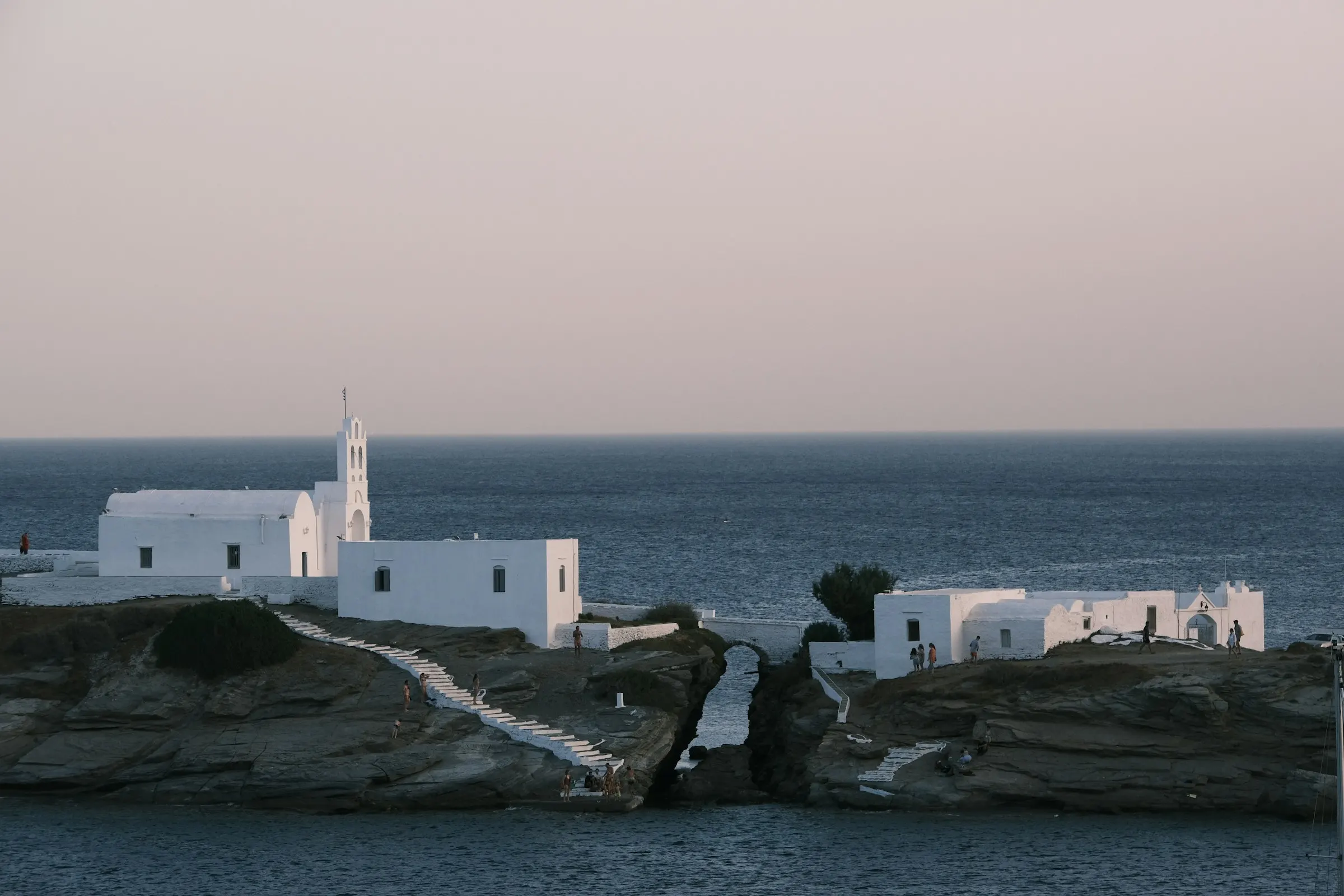 Small white monastery on a rocky headland, Sifnos
